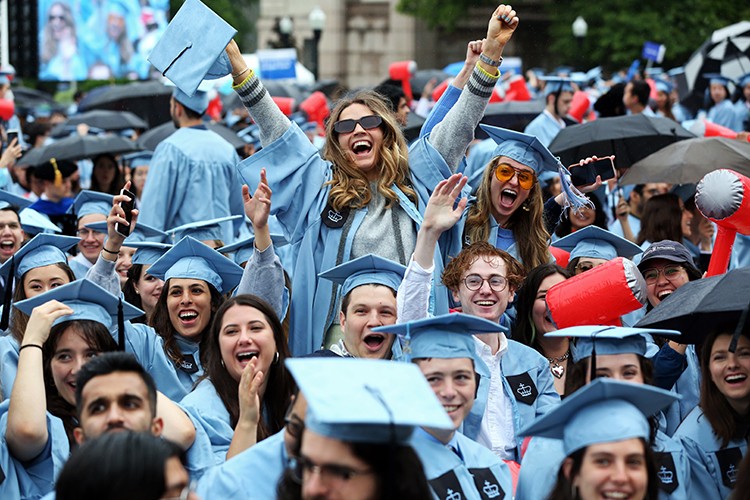 A grad erupts in a cheer during the ceremony for classes of 2020 and 2021. 