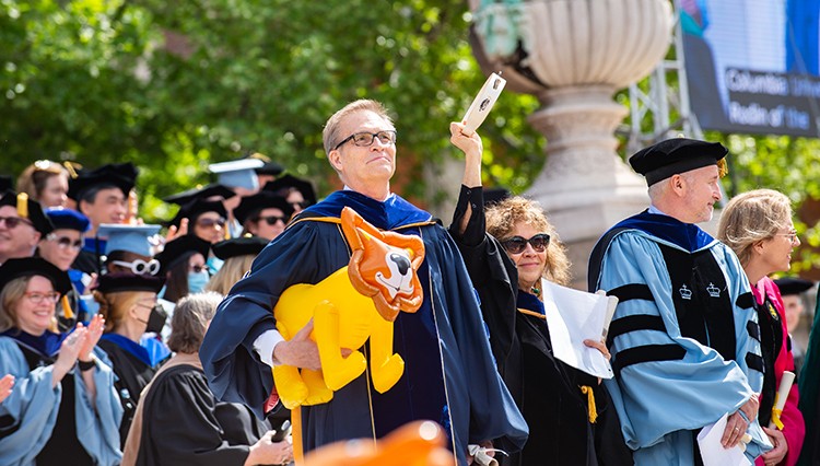 Columbia College Dean James J. Valentini with an inflatable lion