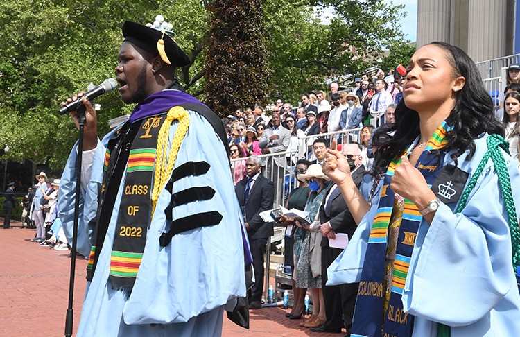 “Lift Every Voice and Sing” was vocally performed by Jordan Alexander James Jarrett (LAW'22) and performed in American Sign Language by Morgan Grant (BC'22). Photo by Eileen Barroso. “Lift Every Voice and Sing” performed by Jordan Alexander James Jarrett and Morgan Grant.