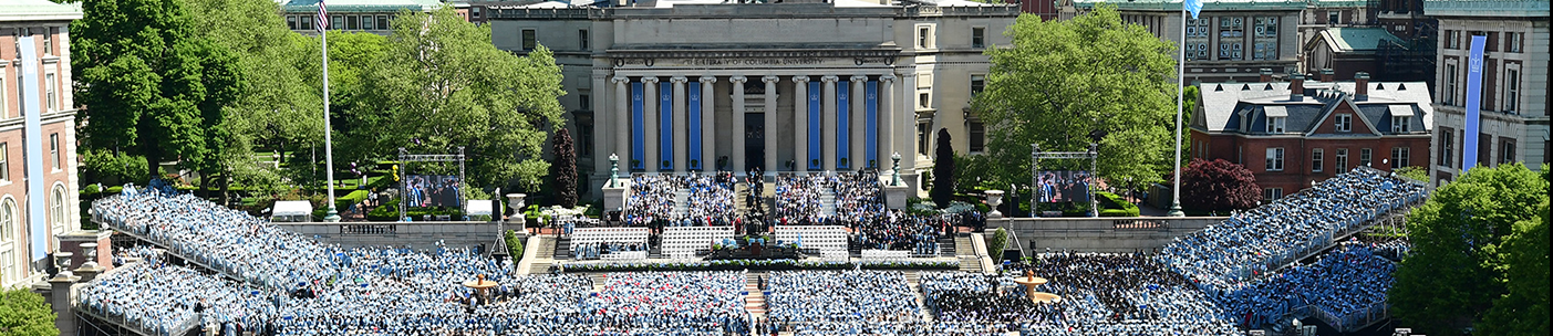 A view of Low Library from Butler Library on commencement day, with tons of people in Blue. 
