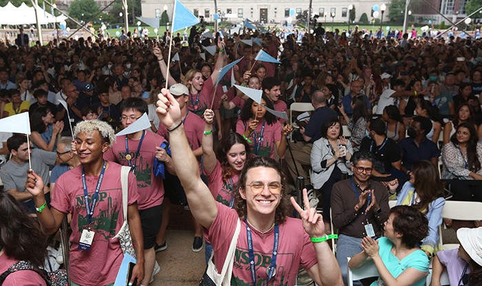 Students wearing "New Student Orientation Program" shirts enter a tent on Low Plaza for Convocation on August 28. Photo by Bruce Gilbert. A crowd of students enters the tent for Convocation.