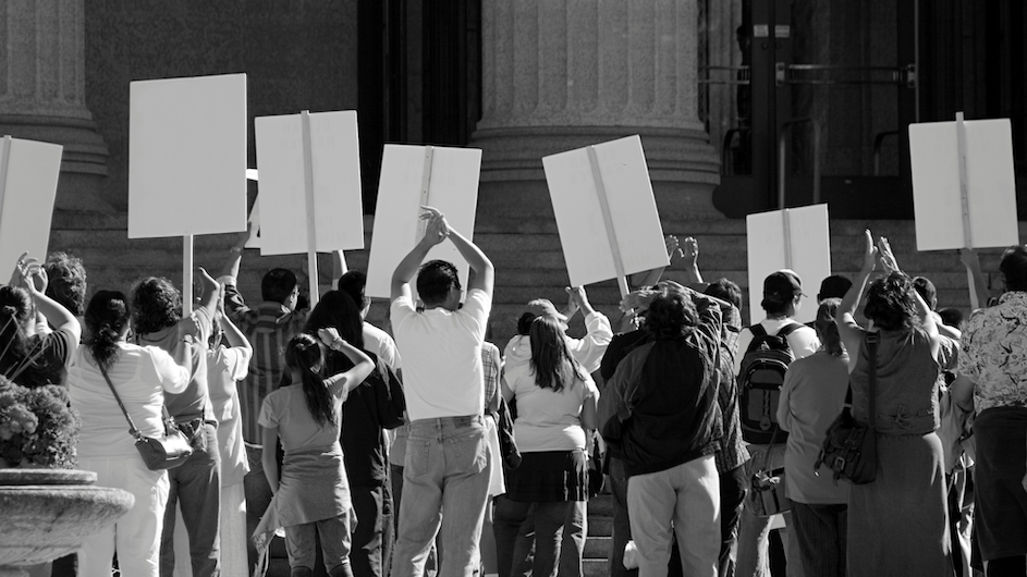 Black and white photo of people protesting