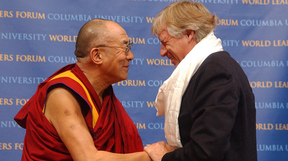 His Holiness the 14th Dalai Lama Tenzin Gyatso of Tibet greets Columbia President Lee C. Bollinger at a World Leaders Forum