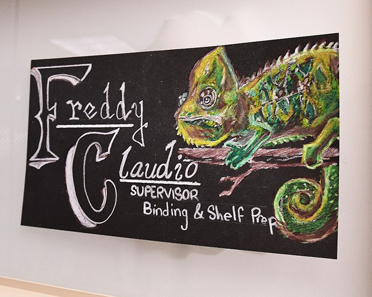 Freddy Claudio's art showing his name, title, and a lizard.