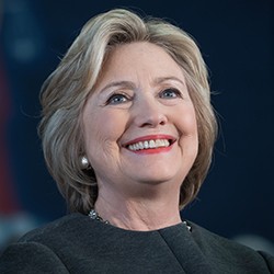 Hillary Rodham Clinton, a woman with blond hair in a black top. 