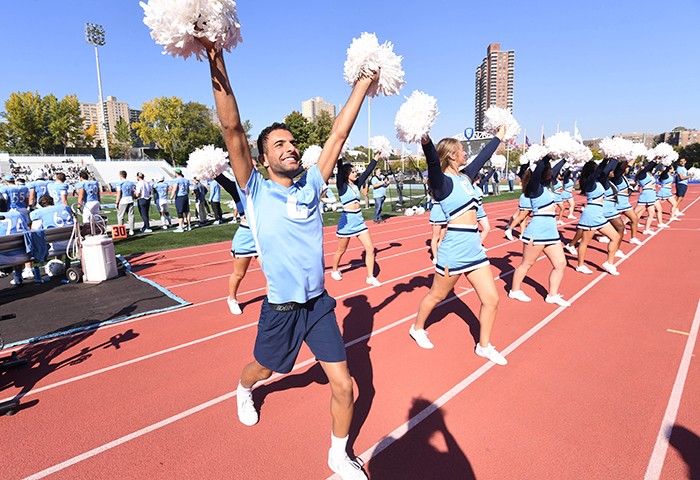 Columbia cheerleaders bring the fierce to Homecoming. Photo by Eileen Barroso/Columbia College. Cheerleaders cheer on Kraft Field.