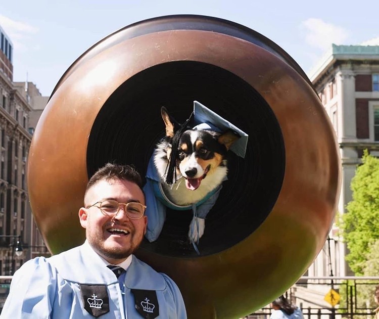 Jon Carlo Dominguez (CC'19) & Hudson the Corgi pose in the Life Force statue on Columbia campus. 