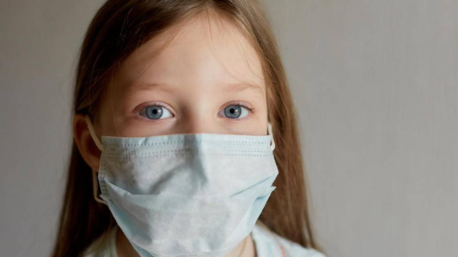 girl wearing a surgical mask