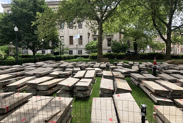 Granite steps are laid out on the lawn in front of Lewisohn Hall for placement