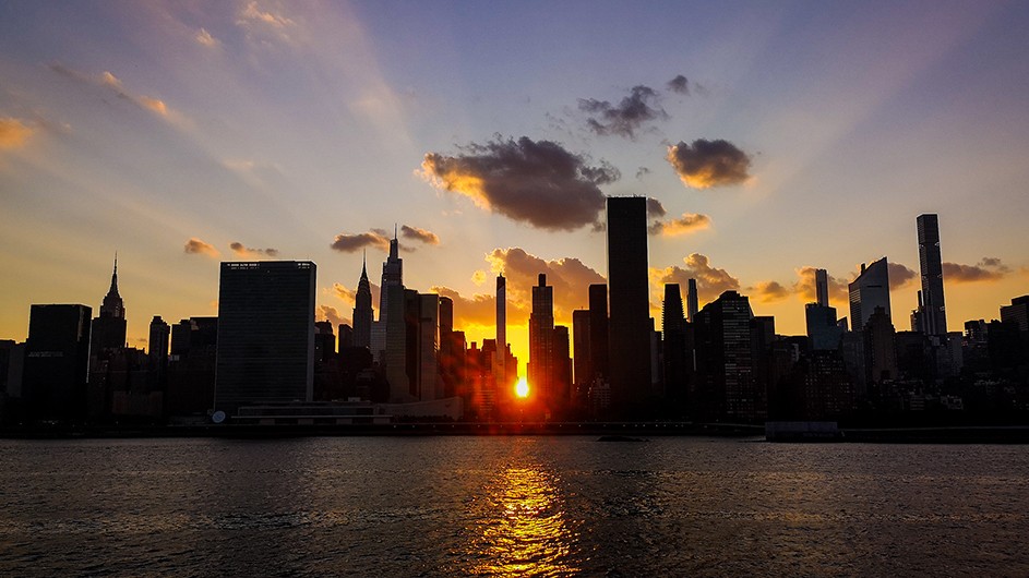 The Manhattan skyline at sunset during Manhattanhenge.