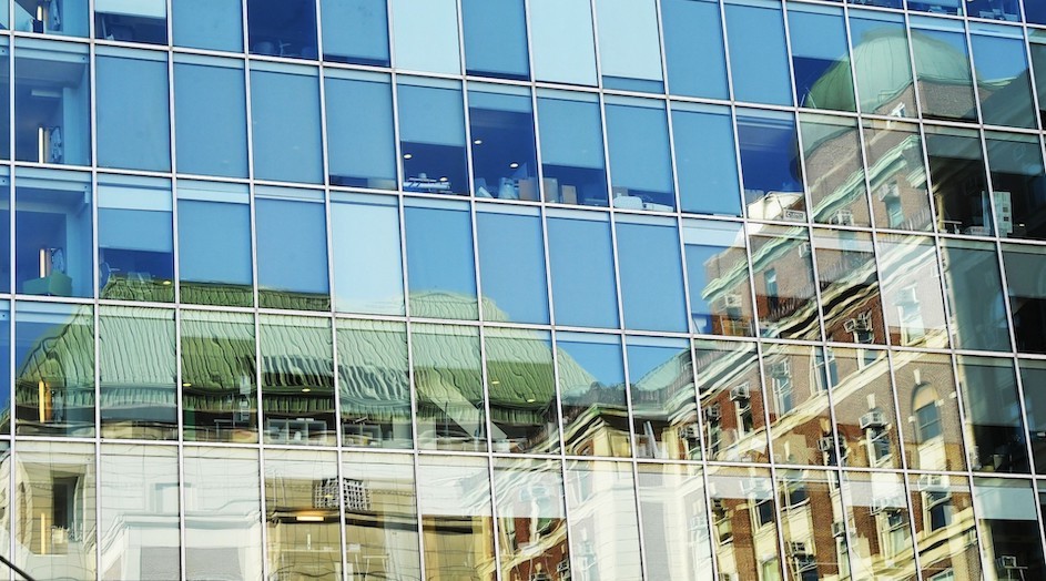 Reflection of Pupin Hall in the glass of the Northwest Corner Building at Columbia University.