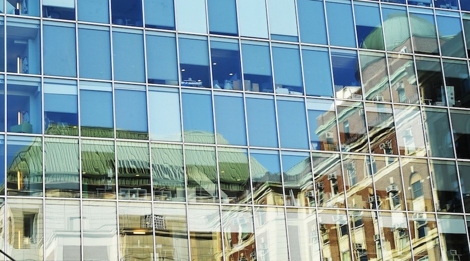 Credit: Eileen Barroso, Columbia University Reflection of Pupin Hall in the glass of the Northwest Corner Building at Columbia University.