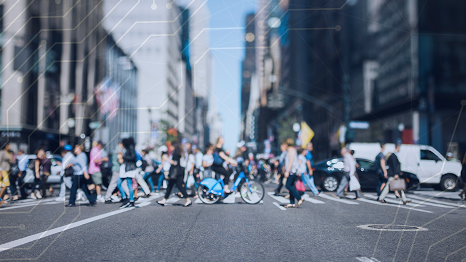 Bikes and pedestrians on a city street.