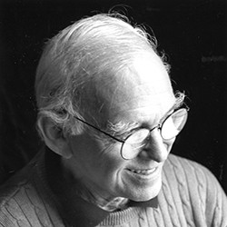 James Stewart Polshek, a man with short, white hair and glasses. 