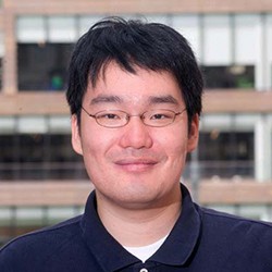 Christopher Hwu, a person with short dark hair and glasses in a dark shirt. 