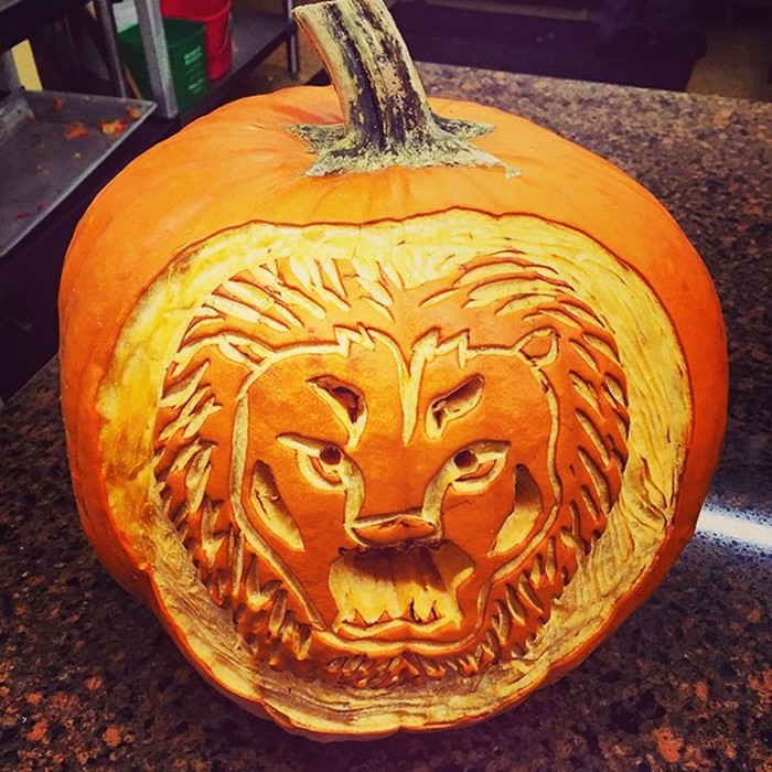 A lion carved into a pumpkin at John Jay Dining