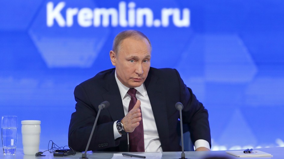 Putin speaking at a conference