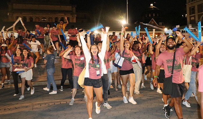 Students take part in Rally 'Round Columbia, a celebration to welcome them to camups. Photo by Olivia Namkoong. Columbia students wave noise makers in the air,