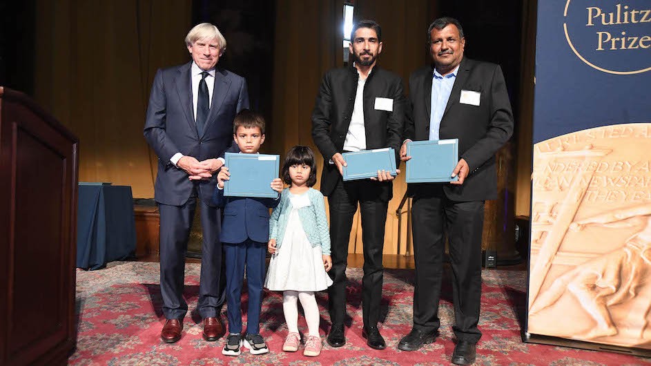 Columbia University President Lee C. Bollinger presents the 2022 Feature Photography Award to (l to r) Yunus and Sarah Siddiqui, children of the late Reuters photojournalist Danish Siddiqui, along with Reuters photojournalists Adnan Abidi and Amit Dave. Photo credit: Eileen Barroso President Lee C. Bollinger with Yunus and Sarah Siddiqui, children of the late Danish Siddiqui, Adnan Abidi, and Amit Dave