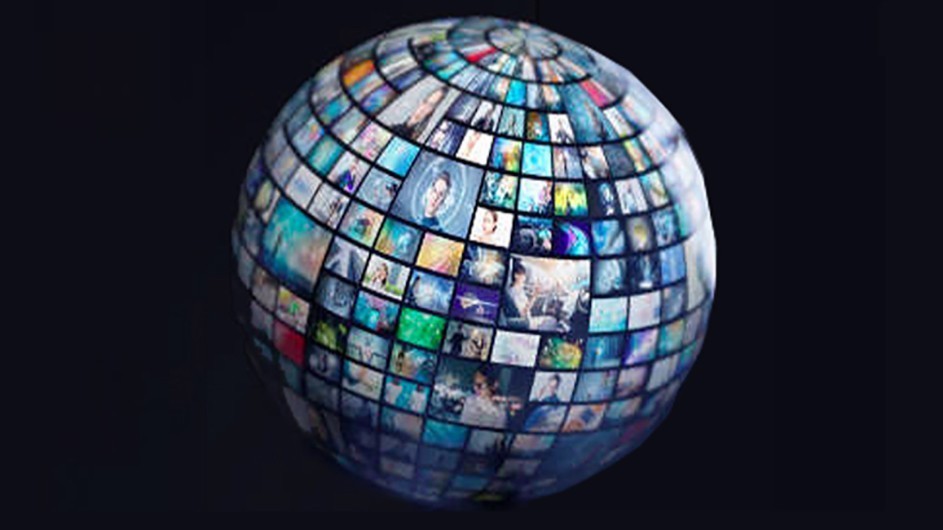A globe with many pictures on it against a black background
