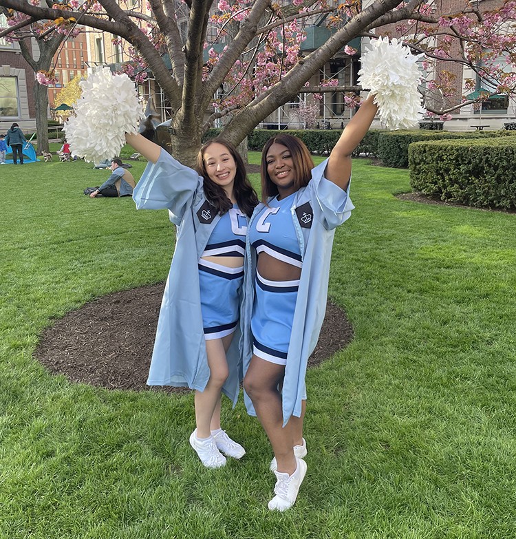 Stefani Parrish and friend in cheerleading uniform
