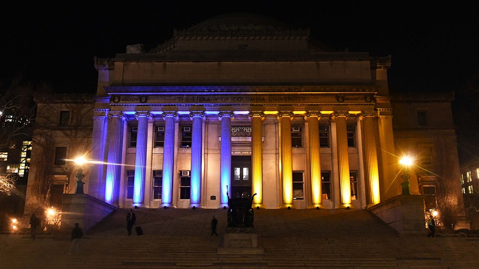 Low Library illuminated with the colors of the Ukrainian flag