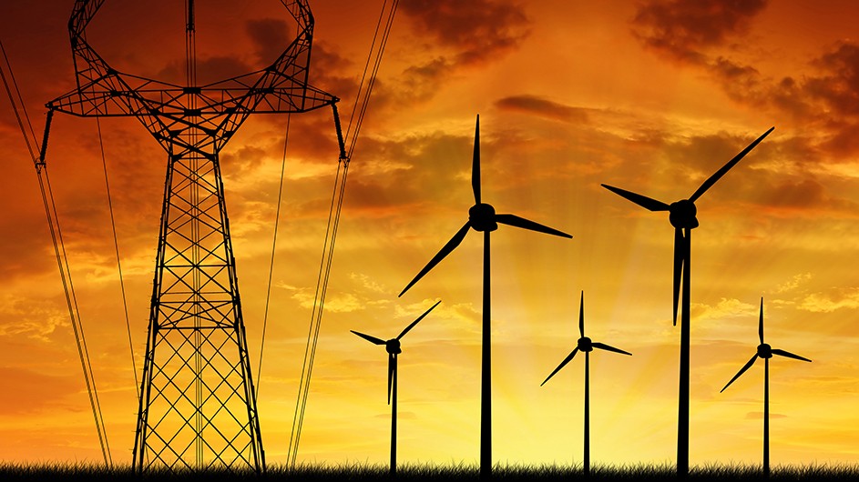 wind turbines and power station at sunset