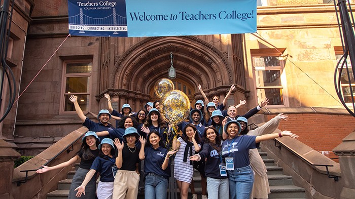 New TC students pose in front of Zankel Hall at Teachers College during orientation. Photo by Kevin Chiu Films LLC/Teachers College. Students pose on the Teachers College steps.