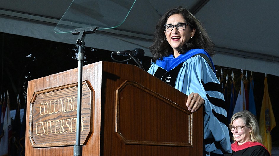 President Shafik at Columbia College and Columbia Engineering Convocation. Photo: Eileen Barroso. President Shafik delivers the Convocation address from a podium under a tent in front of Low Library.
