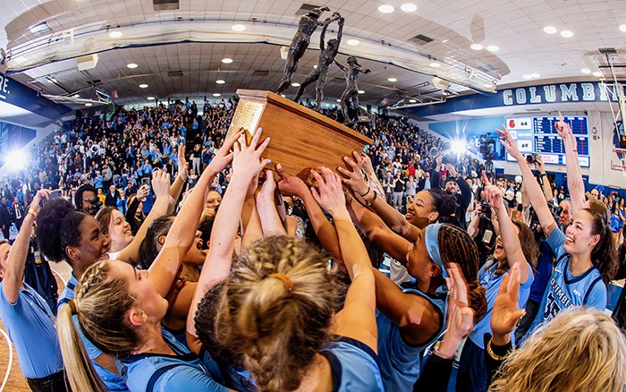 Columbia Women's basketball holds championship trophy