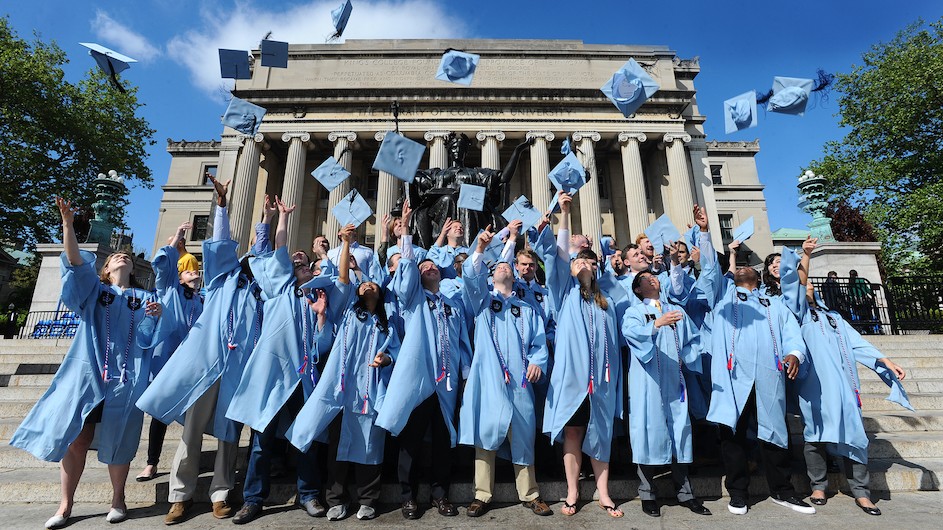 Grads throw caps in the air