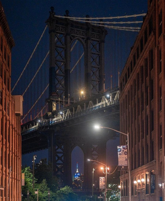 A view of the Empire State Building through the Manhattan Bridge. 