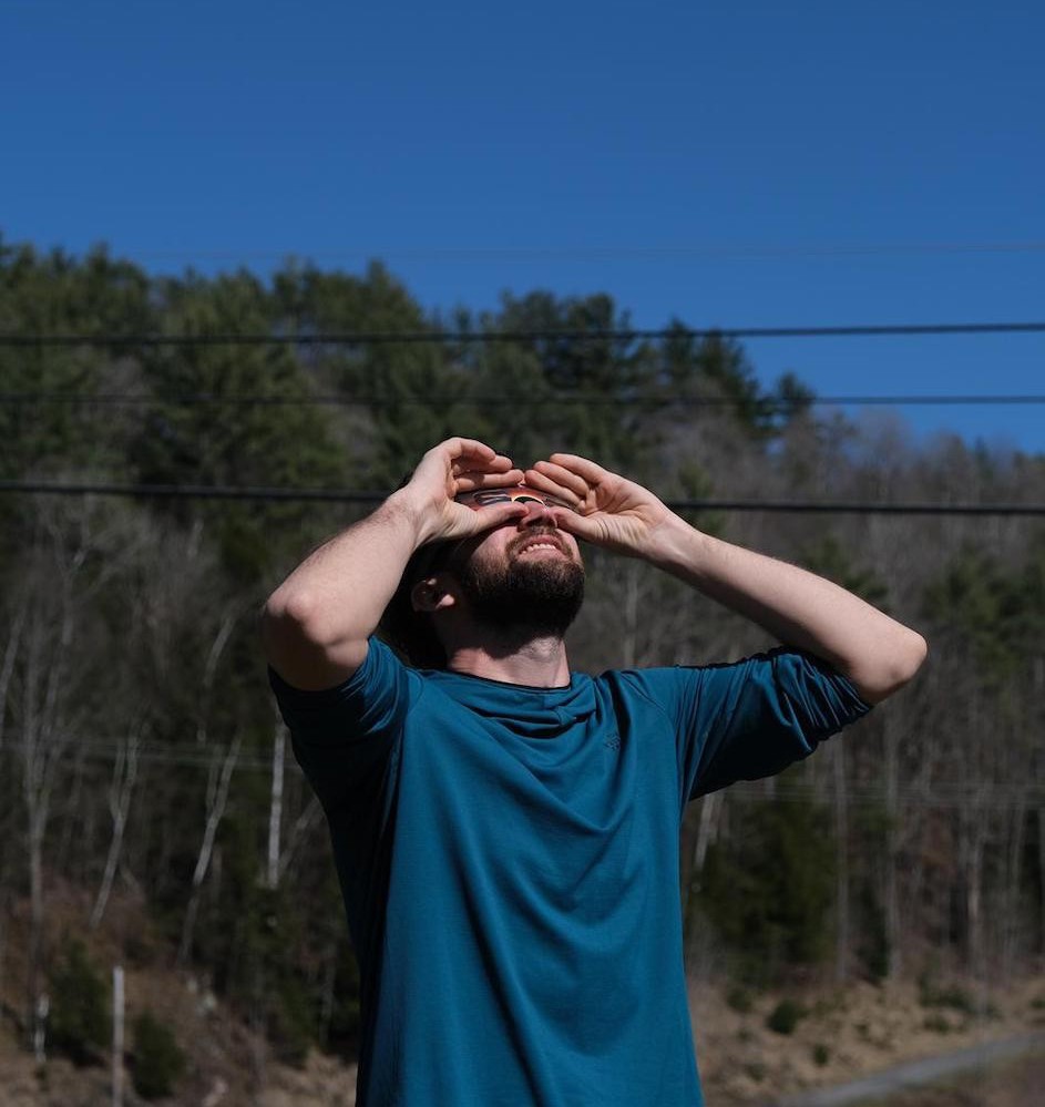 Itai Linial, postdoctoral researcher at Columbia Astrophysics Lab, observing the eclipse in St. Johnsbury, Vermont.