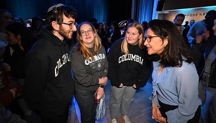 Minouche Shafik with students at reception in Lerner Hall