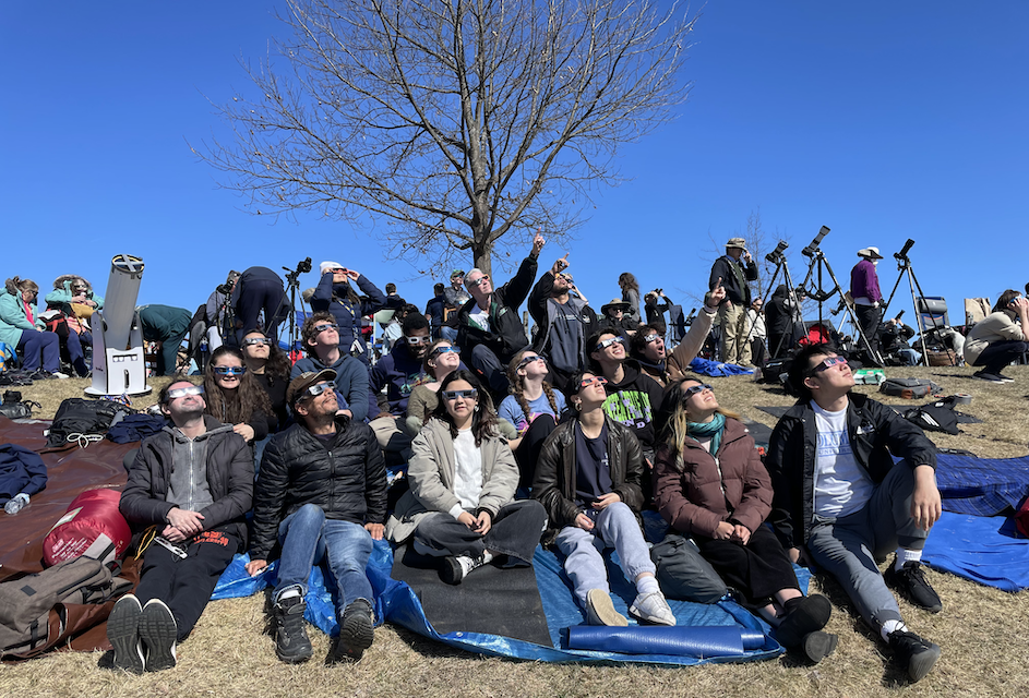 Members of professor David Schiminovich's Observational Astronomy course watch the eclipse in Newport, Vermont.