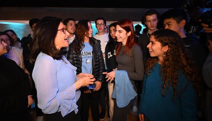 Minouche Shafik with students at a reception in Lerner Hall