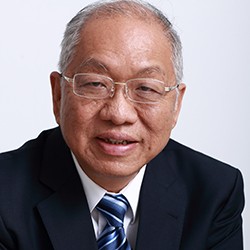 Shing-Tung Yau, a man with short white hair and glasses, in a dark suit and tie. 