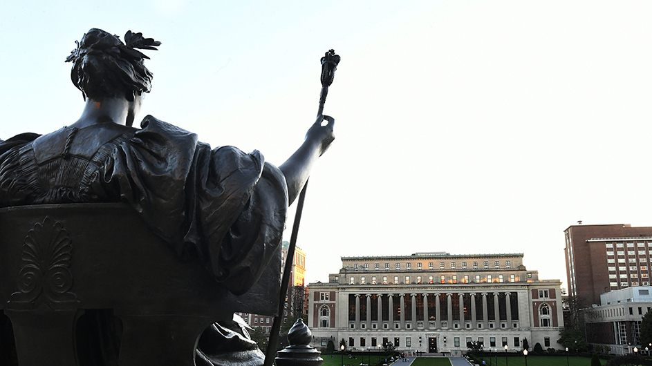 Alma Mater looks out on Butler Library. 