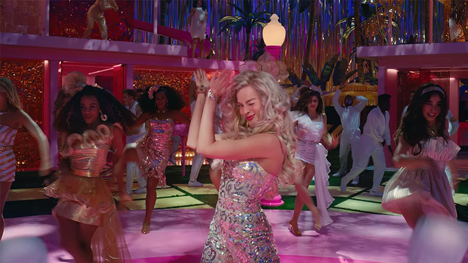 A still from the Barbie Movie, courtesy Warner Bros. Barbie on a dance floor.