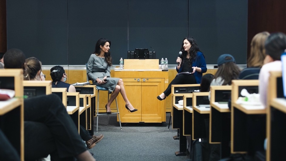 Amal Clooney, Columbia Law School professor, and Human Rights Fellow Natia Navrouzov (LAW'23) in discussion