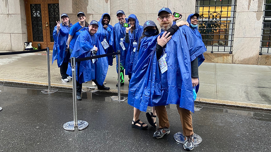 Rain or shine, Dave Roberts (right) has been a stalwart Commencement volunteer for 20+ years. Photo by Leanette Anzules. Dave Roberts and a group of Commencement volunteers.