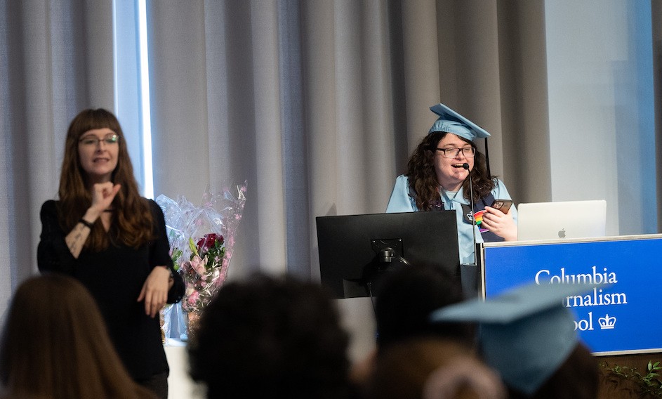 Leslie Zukor speaks at Columbia's first Disability Affinity Graduation celebration while Miriam Rochford translates into sign language. 