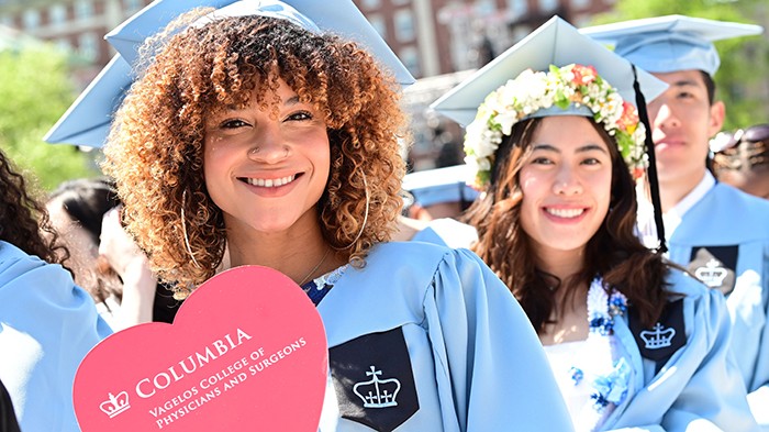 Two Vagelos College of Physicians and Surgeons gradutes. Photo by Chris Taggart. 