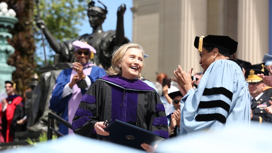 Hillary Rodham Clinton receiving an honorary degree at Columbia University's 2022 Commencement on steps of Low Memorial building.