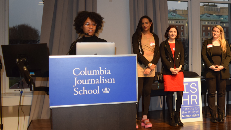 Institute for the Study of Human Rights reception at Columbia University. One person is speaking at a podium and three others are standing behind them.