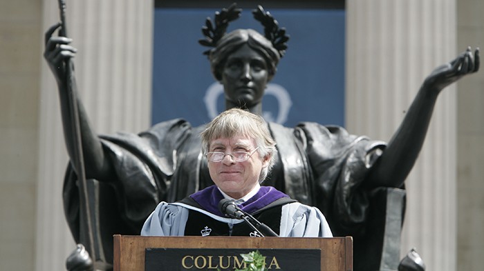 President Bollinger gives a speech in front of the Alma Mater statue at Commencement.