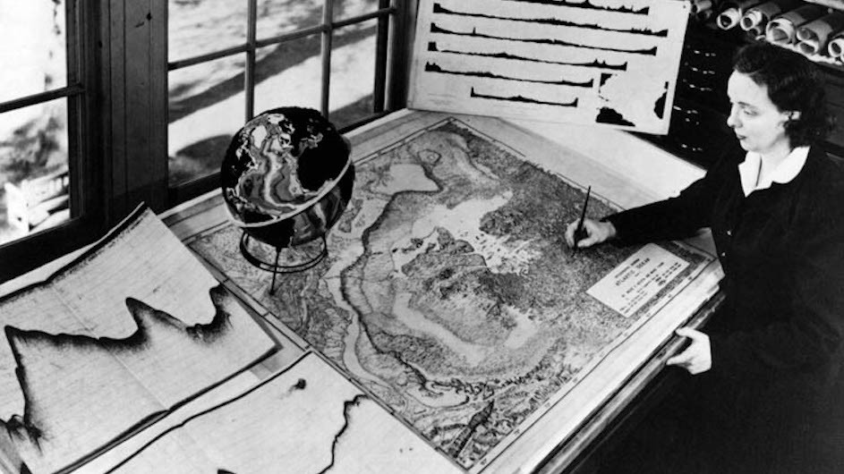 Marie Tharp at work, 1961. As a woman, for much of her career she was barred from the research cruises that collected the data she turned into maps. (Courtesy Lamont-Doherty Earth Observatory)