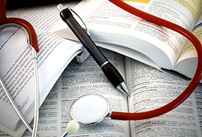 stethoscope and medical text.