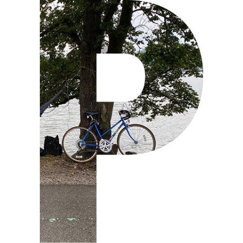 A block letter P with a picture of a bike in the middle
