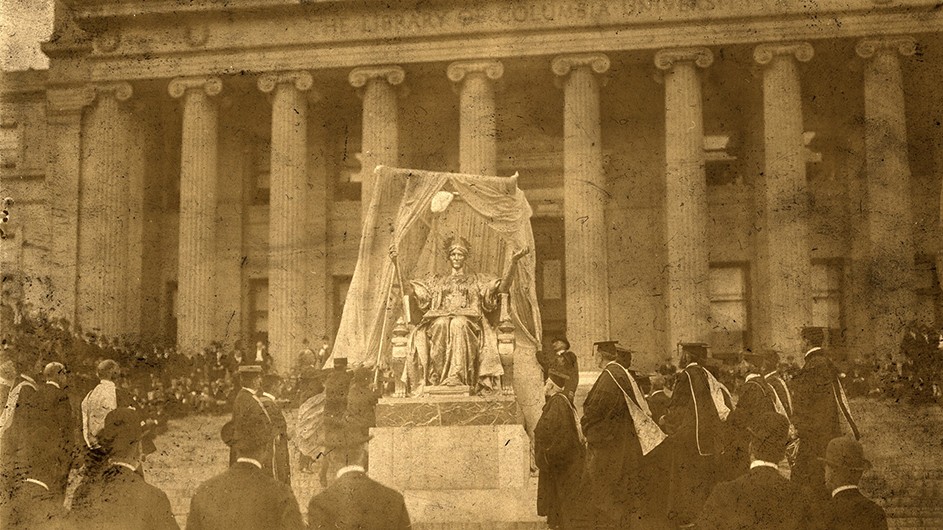 1903 photo of Alma Mater statue unveiling ceremony with dozens of attendees in front of Low Library at Columbia University. 